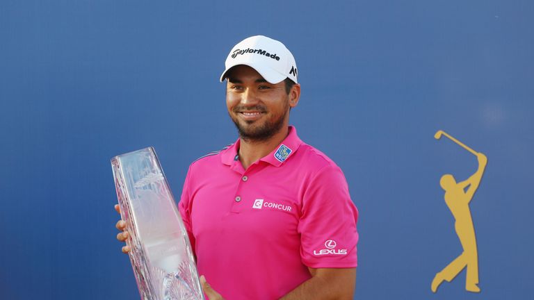 Jason Day of Australia celebrates with the trophy after winning during the final round of THE PLAYERS Championship