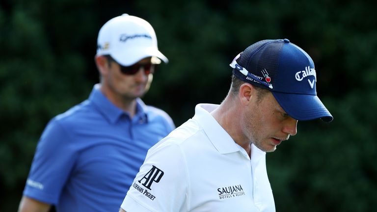 Danny Willett of England and Justin Rose of England walk from the 11th tee during the first round of THE PLAYERS Championship at TPC Sawgrass