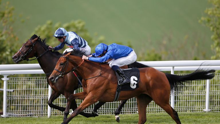 William Buick riding Skiffle (right) win the Veolia Height Of Fashion Stakes at Goodwood