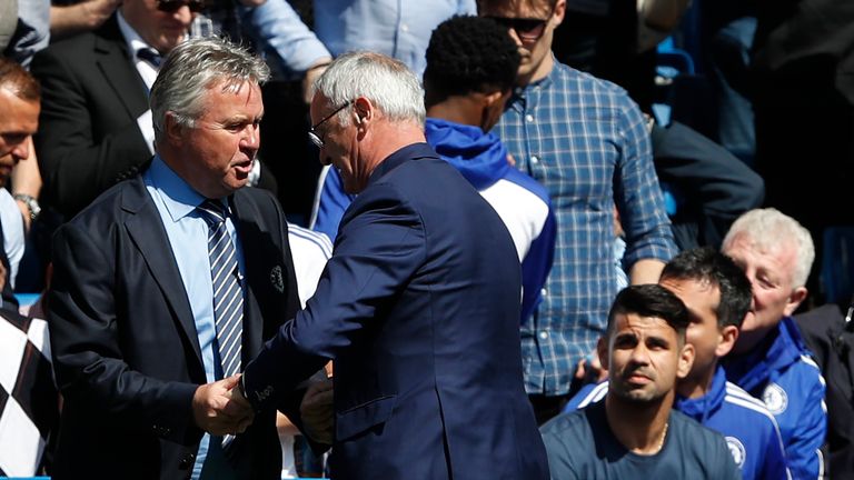 Chelsea's interim manager Guus Hiddink (L) greets Ranieri before the match