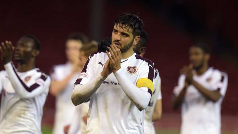Hearts' Alim Ozturk leads the applause for the travelling support at the full time whistle Aberdeen 0-1 Hearts May 2016
