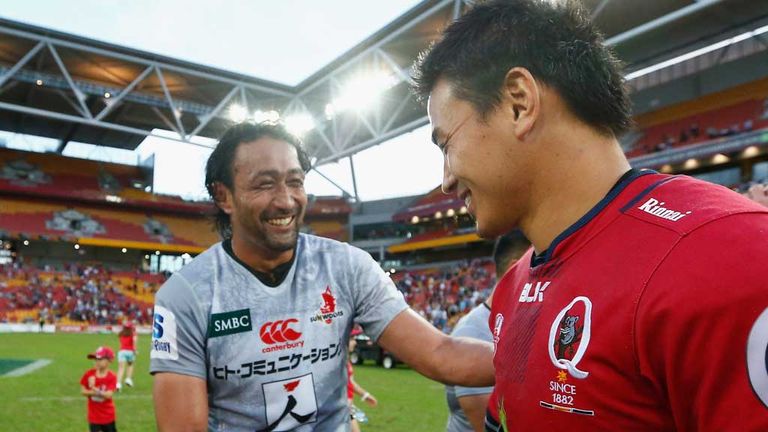 All smiles at the hooter as Ayumu Goromaru of the Queensland Reds (right) shakes hands with Hitoshi Ono of the Sunwolves.