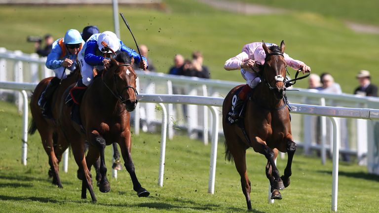 So Mi Dar, (right) ridden by Frankie Dettori comes home to win The Investec Derby Trial from Humphrey Bogart