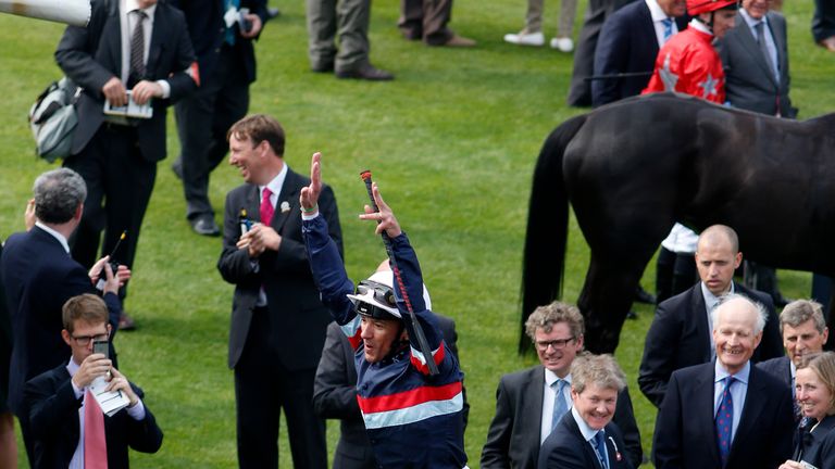 Frankie Dettori leaps from Magical Memory