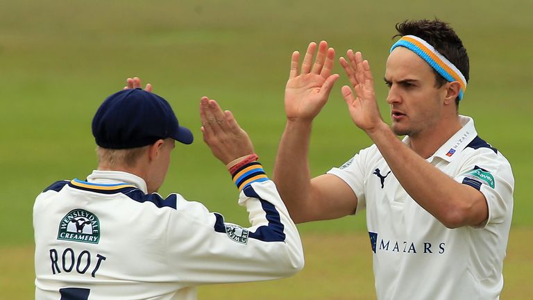 Jack Brooks of Yorkshire celebrates a wicket with Joe Root during day one of the Specsavers County Championship Division One 
