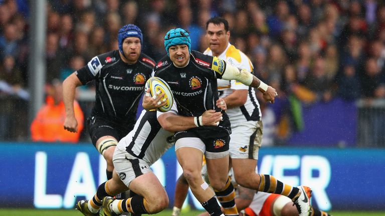 Jack Nowell of Exeter Chiefs bursts through the challenge of Matt Mullan of Wasps during the Aviva Premiership semi final match at Sandy Park