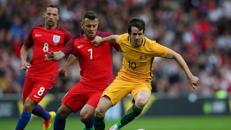 SUNDERLAND, ENGLAND - MAY 27:  Robbie Kruse of Australia holds off the challenge of Jack Wilshere of England during the International Friendly match betwee