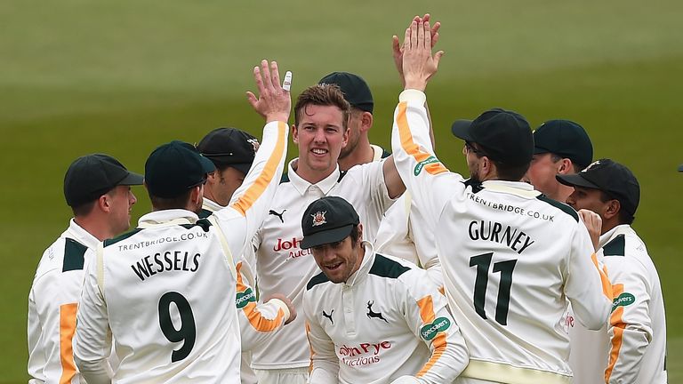 NOTTINGHAM, ENGLAND - MAY 02:  Jake Ball of Nottinghamshire is congratulated on the wicket of Gary Ballance of Yorkshire during the Specsavers County Champ