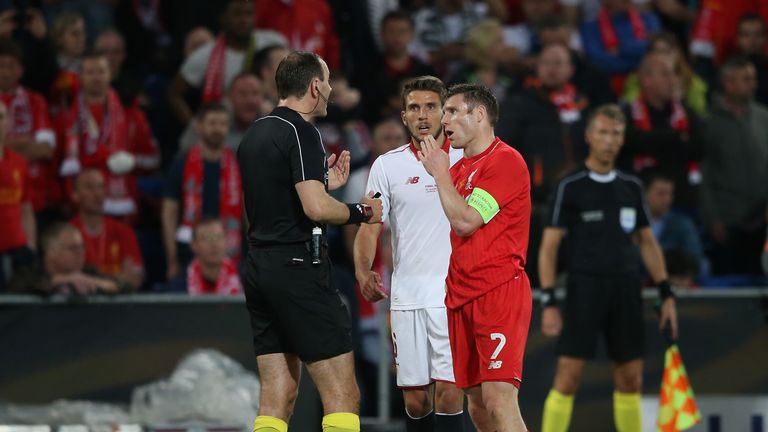 James Milner of Liverpool and referee Jonas Eriksson talk during the UEFA Europa League Final match between Liverpool and Sev
