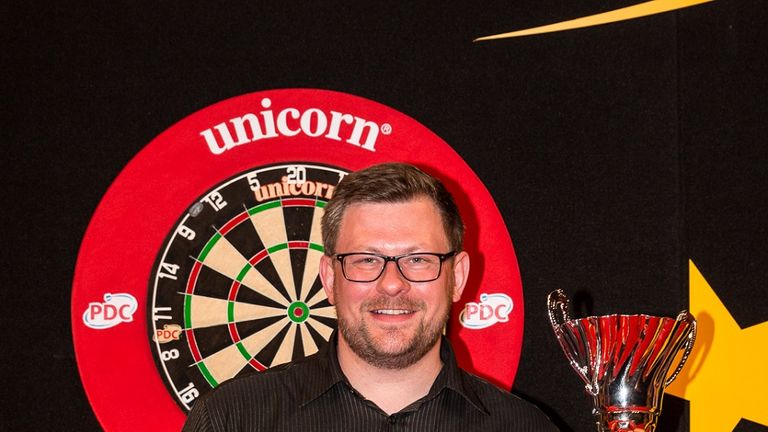 James Wade displays the trophy after winning the European Darts Matchplay title