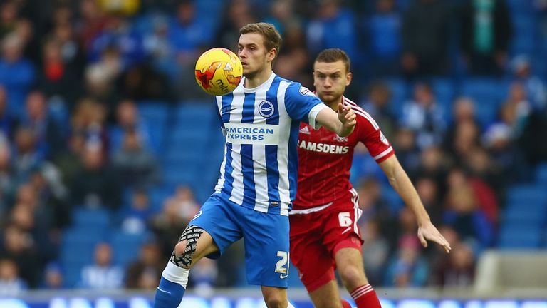 James Wilson of Brighton and Hove Albion shields the ball from Ben Gibson of Middlesbrough