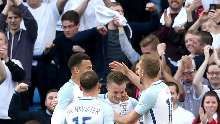 England's Jamie Vardy (centre) celebrates scoring his side's second goal of the game with teammates during the international friendly match at the Etihad S