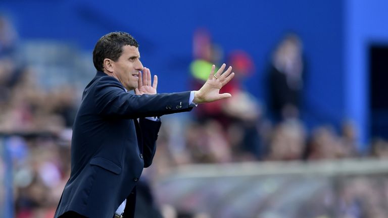 Malaga's coach  gestures on the sideline during the Spanish league football match Club Atletico de Madrid vs Malaga CF at the Vicente Calde