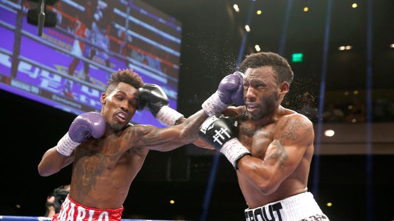 Jermall Charlo (L) beats Austin Trout to the punch in Vegas