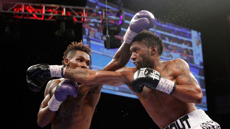 Jermall Charlo (L) beat Austin Trout on points to retain his IBF world title