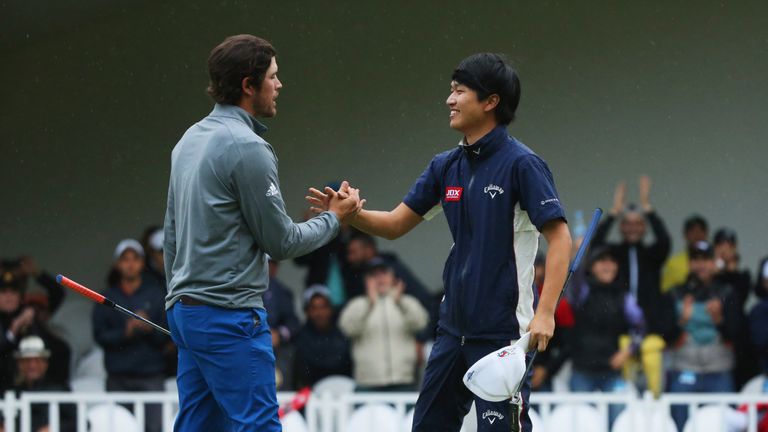 RABAT, MOROCCO - MAY 08:  A victorious Jeunghun Wang of Korea shakes hands with Nacho Elvira of Spain after the winning putt on the second hole (18th) of t