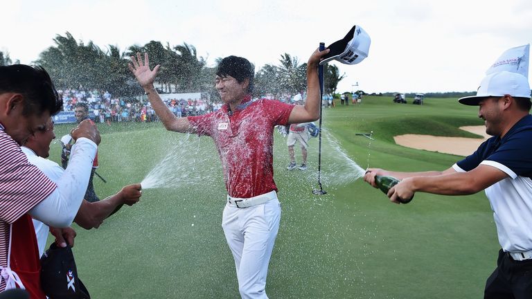 Jeunghun Wang is sprayed with champagne after winning the AfrAsia Bank Mauritius Open