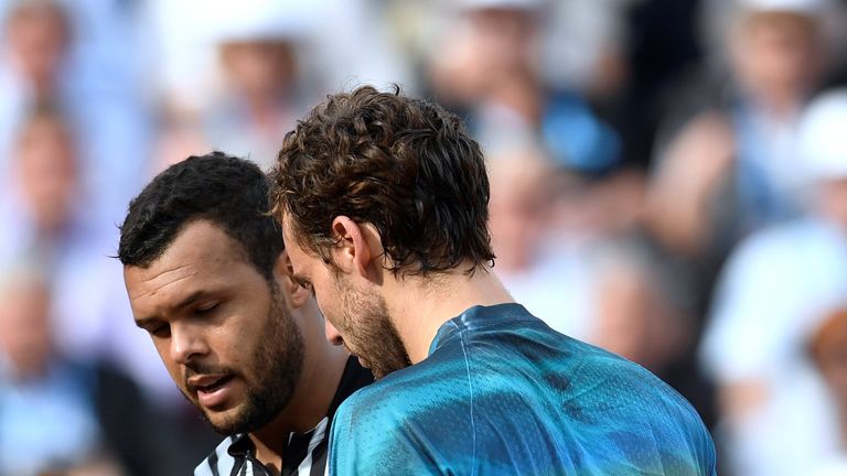 Jo-Wilfried Tsonga leaves the court after withdrawing from his men's third round match against Ernests Gulbis