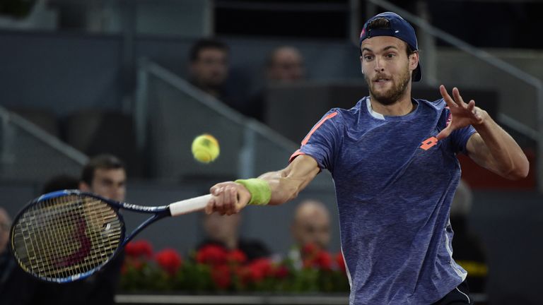 Portuguese tennis player Joao Sousa returns a ball to Spanish tennis player Rafael Nadal during the Madrid Open tournament at the Caja Magica (Magic Box) s