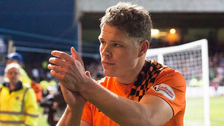 Dundee United midfielder John Rankin leaves the Dens Park pitch after the defeat to Dundee