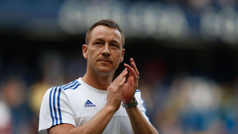 Chelsea's English defender John Terry applauds fans after the English Premier League football match between Chelsea and Leicester City at Stamford Bridge i