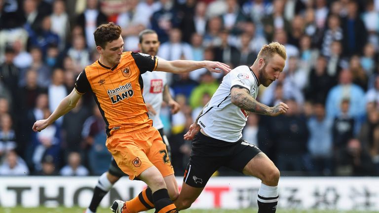 Johnny Russell of Derby County evades Andrew Robertson of Hull City during the Championship play-off semi-final first leg