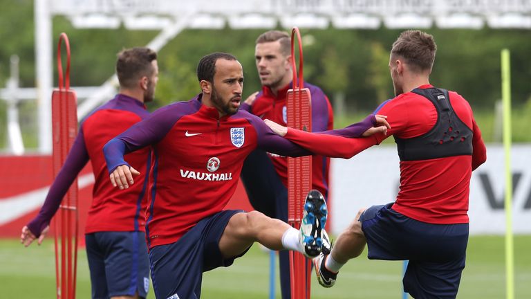 Jordan Henderson (second right) joins in training session with team-mates Jack Wilshere, Andros Townsend and Jamie Vardy