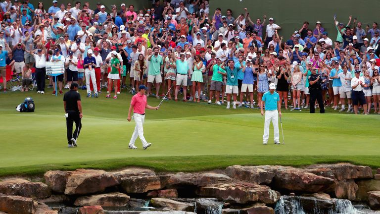 Jordan Spieth reacts to a birdie putt on the 17th hole - he trails Brooks Koepka by two shots