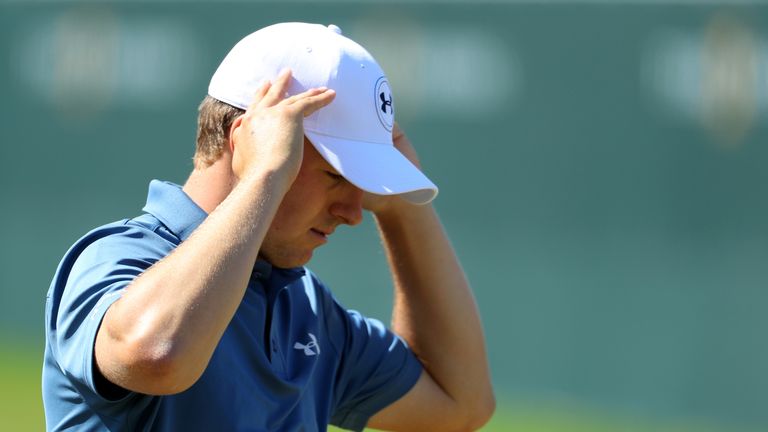 Jordan Spieth of the USA looks dejected as he walks off the 18th green during the resumption of the Players Championship at Sawgrass