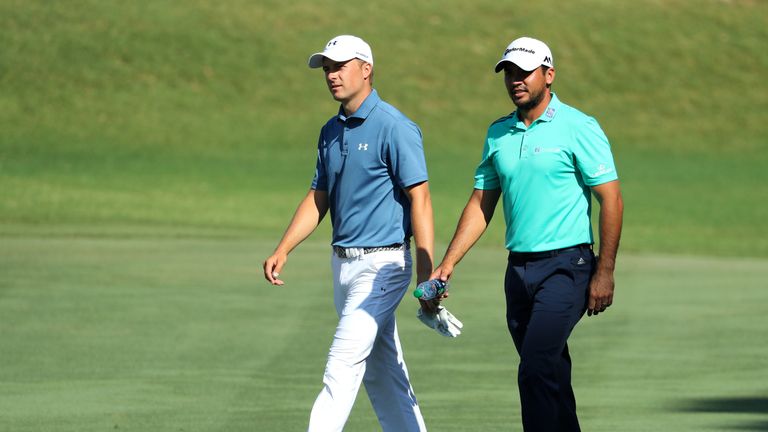 Jordan Spieth of the USA and Jason day of Australia walk down the 16th fairway during the resumption of the Players Championship at Sawgrass