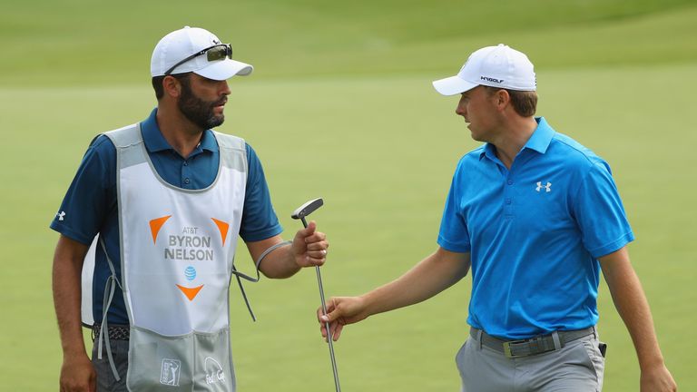 Jordan Spieth is seen with his caddie, Michael Greller, on the 16th green during Round Two at the AT&T Byron Nelson on May 20, 2016 in