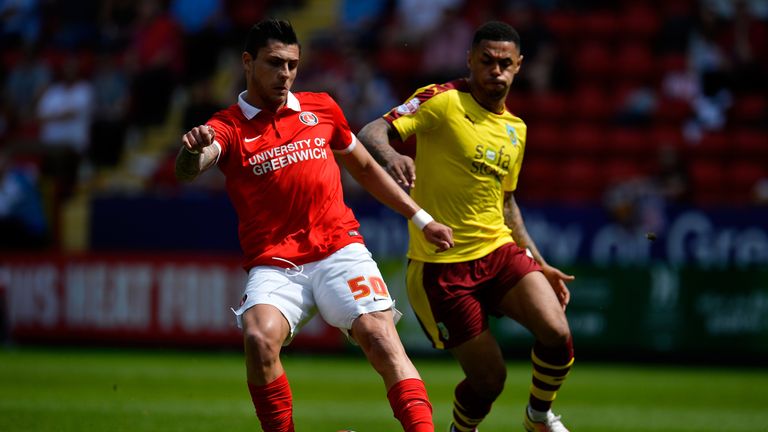Jorge Teixeira of Charlton and Andre Gray of Burnley battle for the ball