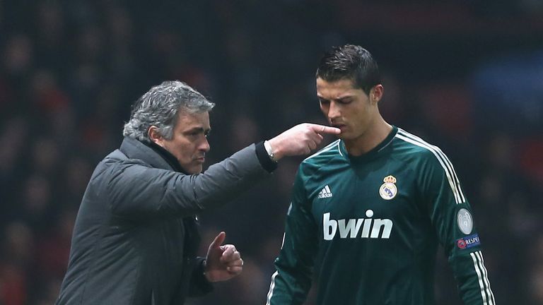 MANCHESTER, ENGLAND - MARCH 05:  Real Madrid Manager Jose Mourinho gives orders to Cristiano Ronaldo during the UEFA Champions League Round of 16 Second le