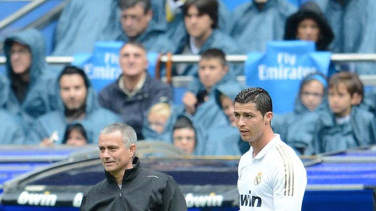 Real Madrid's coach Jose Mourinho (L) stands next to Real Madrid's Portuguese forward Cristiano Ronaldo (R)