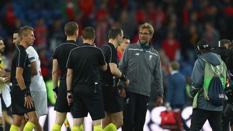 Jurgen Klopp, manager of Liverpool talks with match officals
