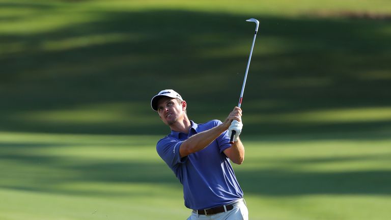 Justin Rose of England pitches to the 11th green during the first round of THE PLAYERS Championship on May 12, 2016 