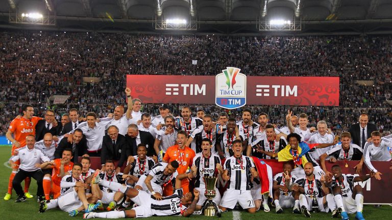 Juventus FC players celebrate with the trophy after winning the TIM Cup