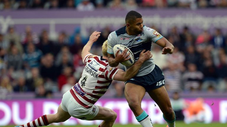 NEWCASTLE UPON TYNE, ENGLAND - MAY 30:  Kallum Watkins (R) of Leeds Rhinos tackled by Dan Sarginson of  Wigan Warriors during the Super League match betwee