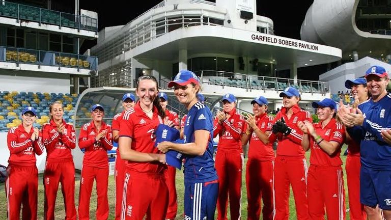Kate Cross receives her England cap from Charlotte Edwards
