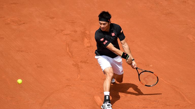 Kei Nishikori of Japan plays a backhand during the Men's Singles second round match against Andrey Kuznetsov at French Open