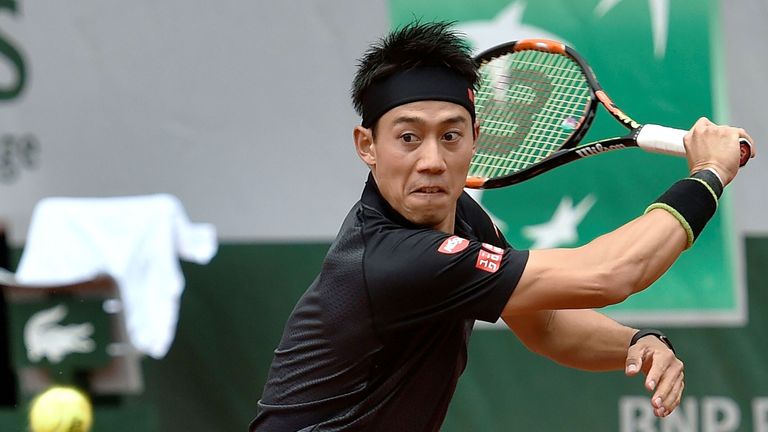 Japan's Kei Nishikori hits a return to Italy's Simone Bolelli