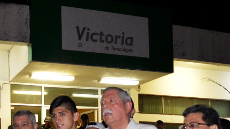 Mexico's Governor Egidio Torre Cantu (2-R) speaks following the release of the Mexico football star Alan Pulido (2-L)