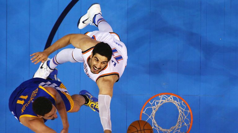  Klay Thompson #11 of the Golden State Warriors shoots the ball against Enes Kanter #11 of the Oklahoma City Thunder during the