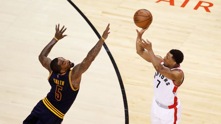 Kyle Lowry #7 of the Toronto Raptors shoots against J.R. Smith #5