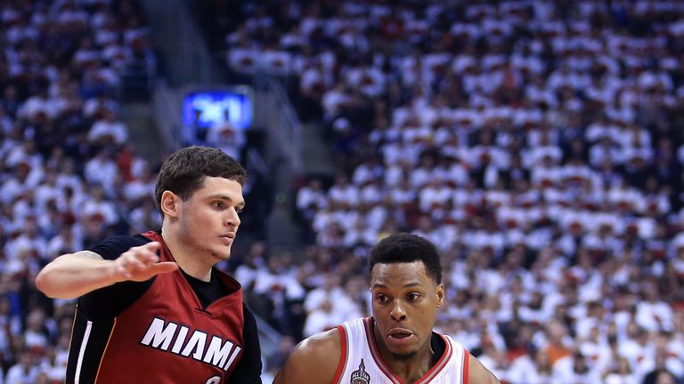 TORONTO, ON - MAY 15:  Kyle Lowry #7 of the Toronto Raptors dribbles the ball as Tyler Johnson #8 of the Miami Heat defends in Game Seven of the Eastern Co