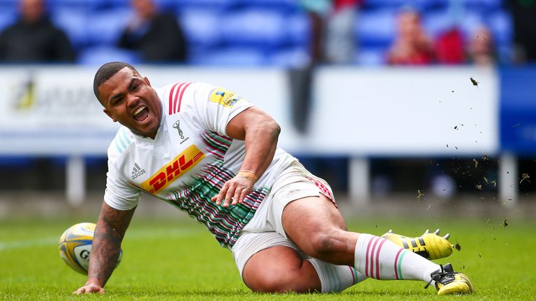 Kyle Sinckler of Harlequins celebrates as he touches down a try 