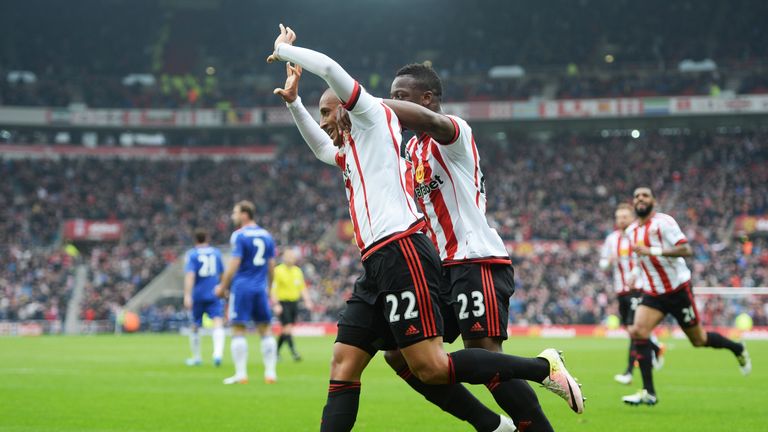 Wahbi Khazri of Sunderland celebrates scoring his team's first goal with his team mate Lamine Kone during the Premier League game against Chelsea