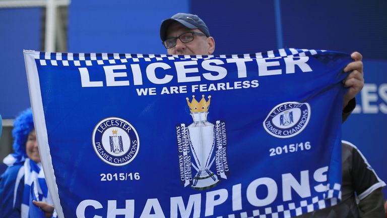 Leicester City fan with champions flag banner