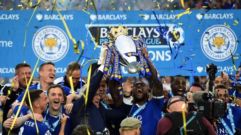  Captain Wes Morgan and manager Claudio Ranieri of Leicester City lift the Premier League Trophy