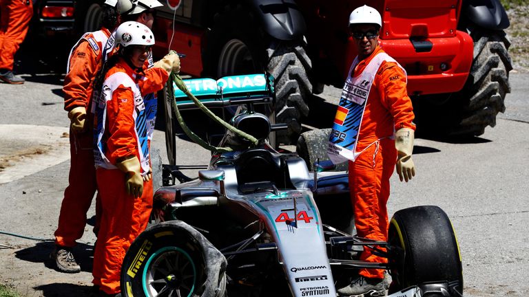 The broken remains of the car of Lewis Hamilton after he crashed into Mercedes team-mate Nico Rosberg at the start of the Spanish Grand Prix